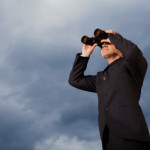 Businessman Looking Through Binoculars